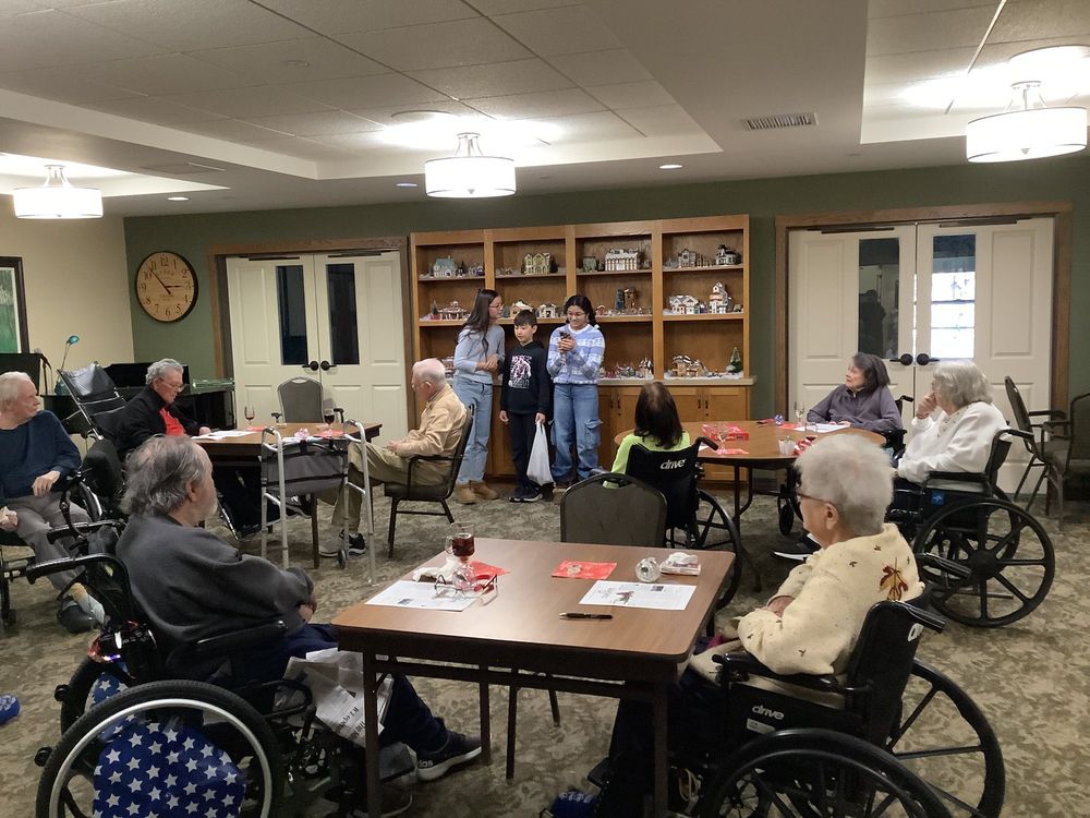 Summer handing out ornaments at retirement home