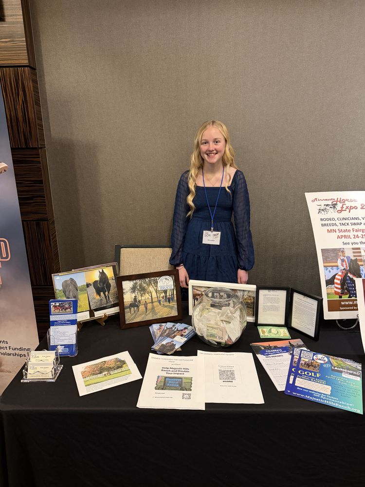 Nora presenting her project at a display table
