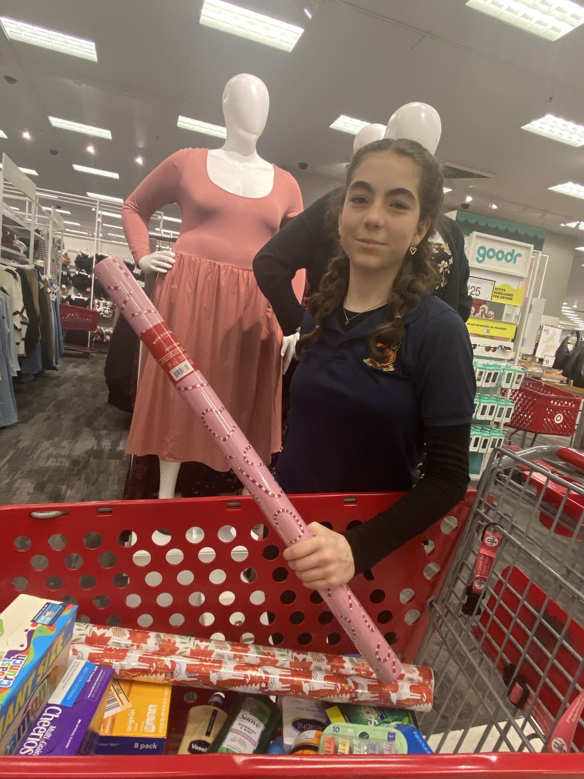 Emily shopping for hygiene and non-perishable food items for Project 150