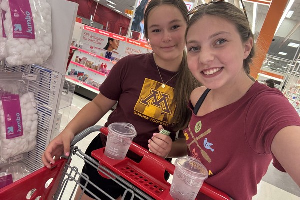 Carys and Aubrey shopping for teacher gift supplies at Target