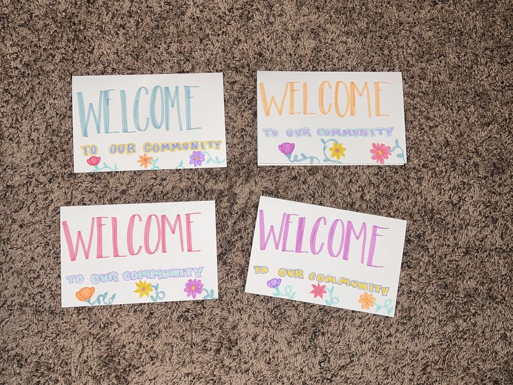 Four handmade Welcome to Our Community cards for refugee families