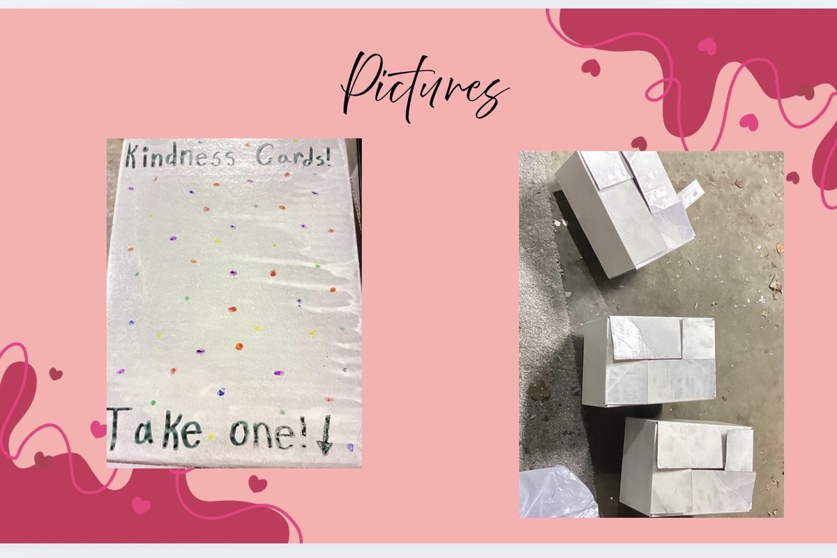 A hand-lettered 'Kindness Cards, Take one!' sign beside three white spray-painted donation boxes on the floor